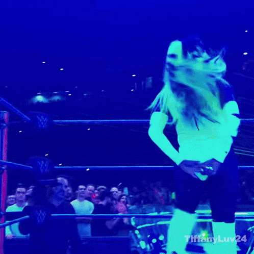 a gif of a woman in a wrestling ring with the hashtag tiffanyluv24 at the bottom