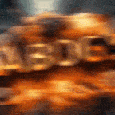 a blurred image of the word bride in orange