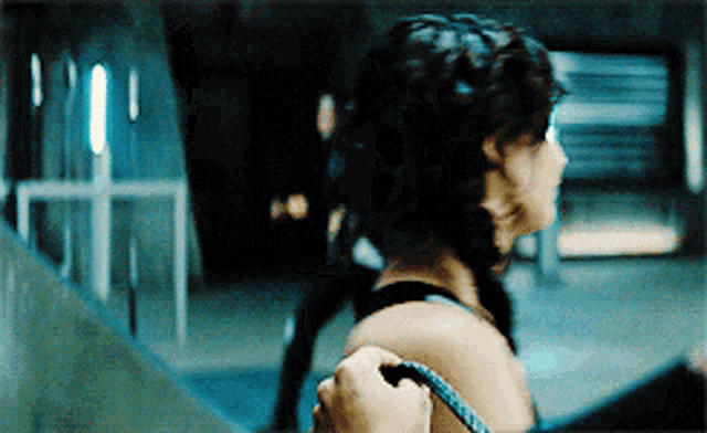 a woman in a braided hairstyle is being held by a man