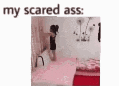a woman is standing on a bed in a room with the words `` my scared ass '' written on the bottom .