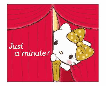 hello kitty peeking out from behind a red curtain with the words just a minute below her