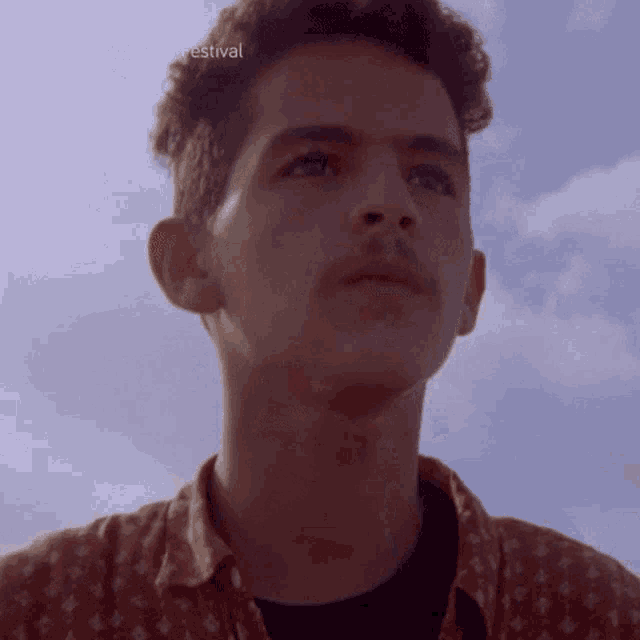 a close up of a man 's face with the words la guarimba film festival visible