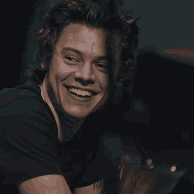 a close up of a man 's face with a smile on his face