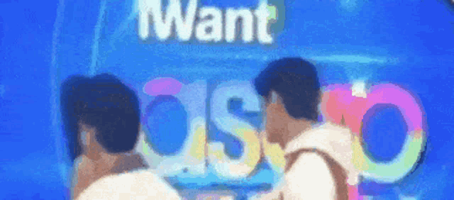 a group of people standing in front of a sign that says i want disco