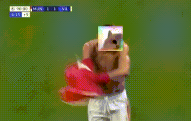 a shirtless soccer player with a picture of a dog on his face