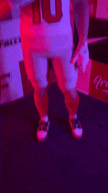 a blurry picture of a person wearing a jersey with the number 11 on it