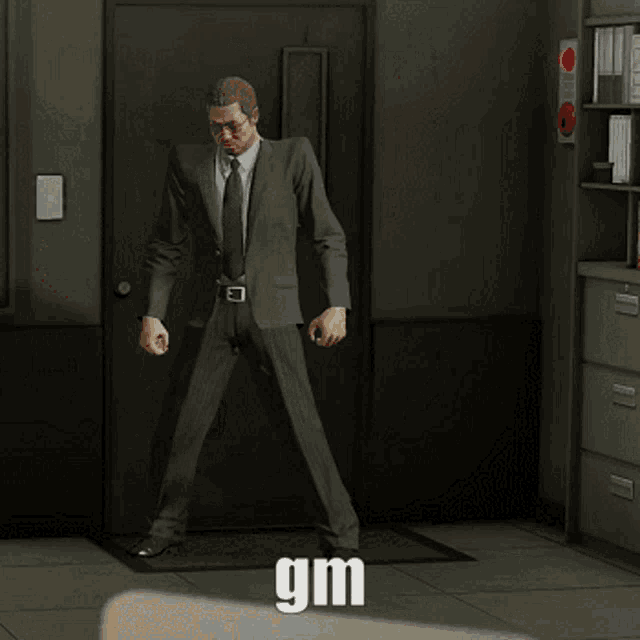 two men in suits are dancing in a room with the word gm written on the floor