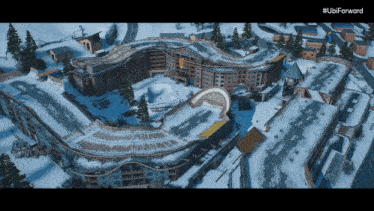 an aerial view of a snow covered building with the ubi forward logo on the bottom right