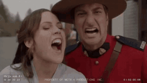 a man in a red uniform is standing next to a woman .