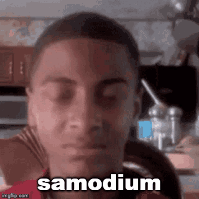 a close up of a man 's face with the words samodium written on it