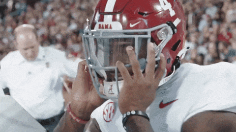 a football player wearing a helmet with the number 4 on it