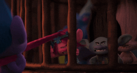a group of trolls are in a cage and one of them has a red nose