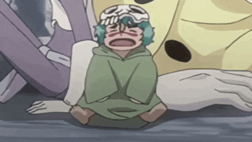a cartoon character is sitting on the ground with a skull mask on .