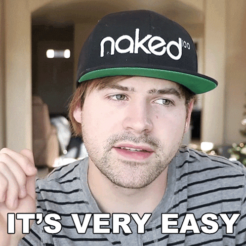 a man wearing a hat that says naked on it says it 's very easy
