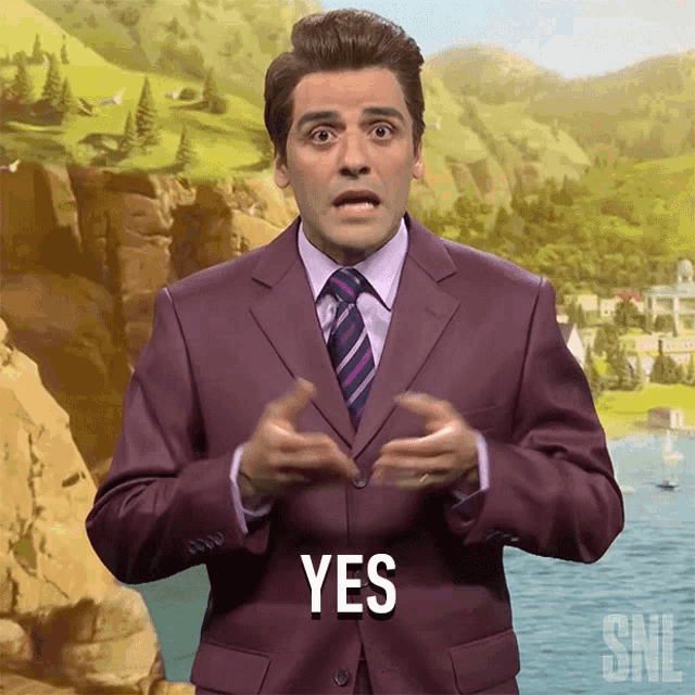 a man in a purple suit and tie says " yes "