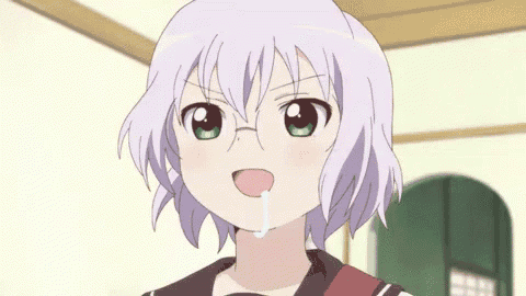 a girl with gray hair and green eyes is making a funny face