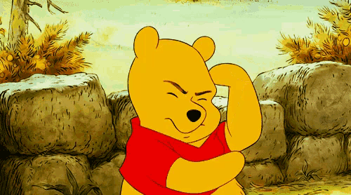 winnie the pooh is flexing his muscles in a cartoon