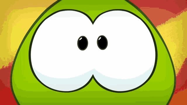 a close up of a green cartoon character with big eyes