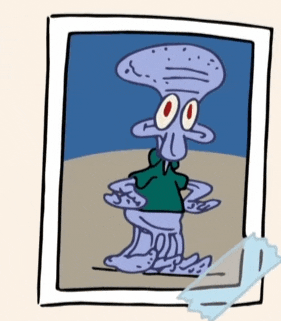 a picture of squidward from spongebob squarepants is taped to a wall