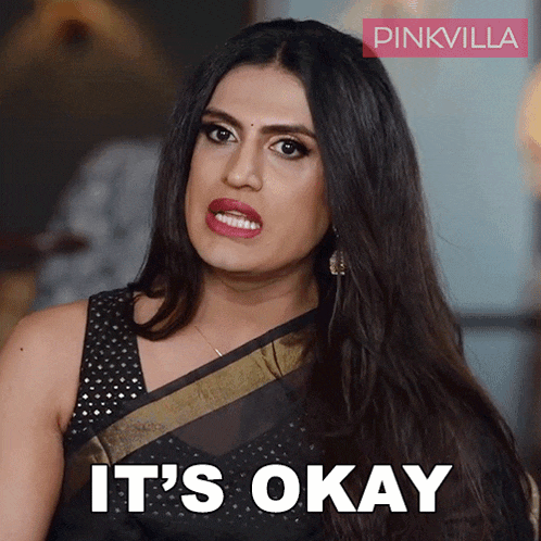a woman in a black saree says it 's okay on a pinkvilla poster
