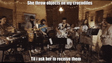 a group of people playing instruments with a caption that says she throw objects on my crocodiles til i ask her to receive them