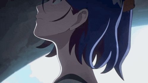 a close up of a person 's head with blue hair