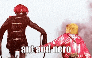 a couple of people standing next to each other with the words `` ant and nero '' .