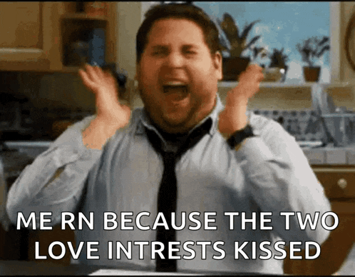 a man in a tie is screaming in a kitchen with the words me rn because the two love interests kissed