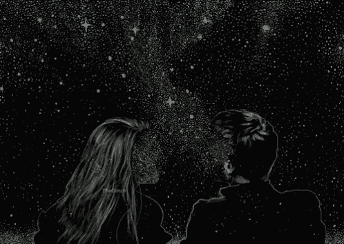 a man and a woman are looking at the stars in the night sky