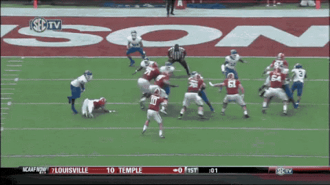 a football game between louisville and oklahoma