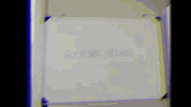 a close up of a white box with a purple border