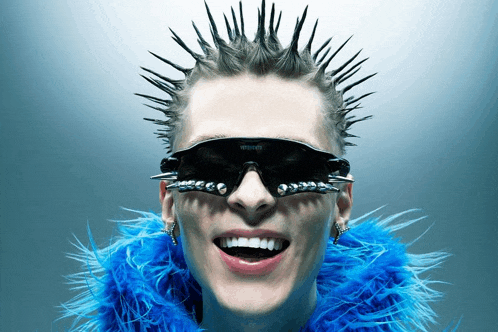 a woman wearing a mohawk and sunglasses with the word sunglasses on them