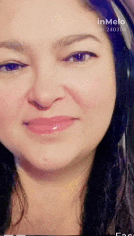 a close up of a woman 's face with the words inmelo on the bottom right