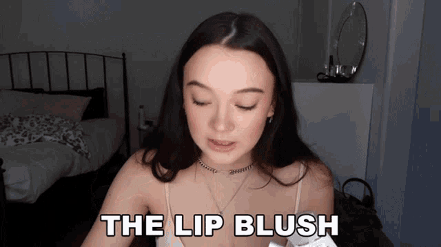 a woman says the lip blush in front of her face