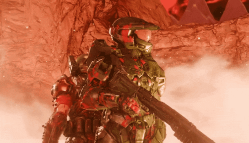 a man in a red and green armor is holding a rifle