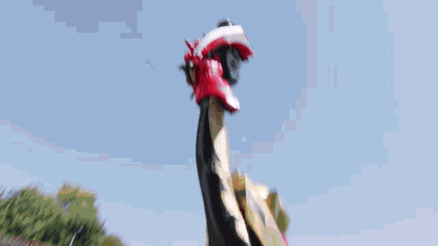 a painting of a red samurai with a yellow crown
