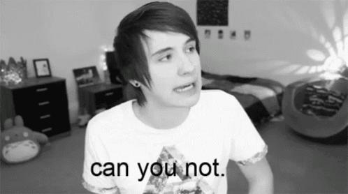 a black and white photo of a young man with the words can you not on his shirt .