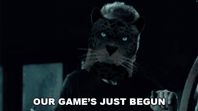 a man with a leopard 's head is holding a guitar and says `` our game 's just begun '' .