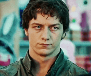 a close up of a man 's face with a serious expression