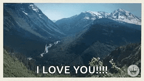 a picture of a mountain valley with the words `` i love you ''