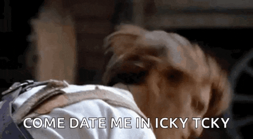 a dog is sniffing a man 's back and says `` come date me in icky tcky ''