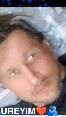 a close up of a man 's face with the word ureyim written on the bottom