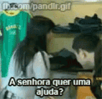 a man and a woman are talking to each other in a store and the woman is asking for help .