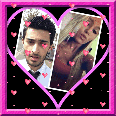 a man and a woman are surrounded by pink hearts