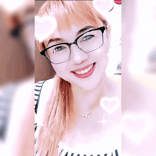 a woman wearing glasses and a necklace with the number 8 on it