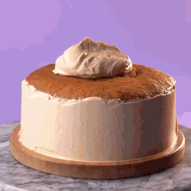 a cake on a wooden cutting board that says mr.cakes on it