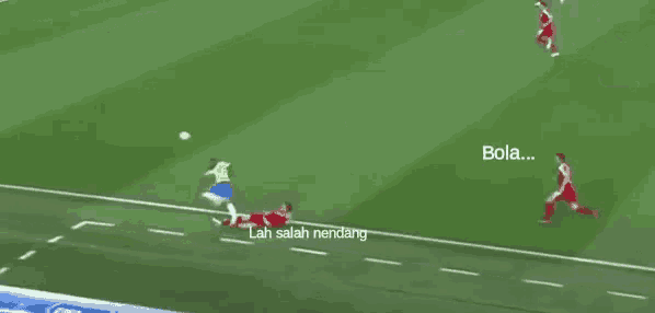 a soccer game is being played with the words bola and lampus gue written on the field