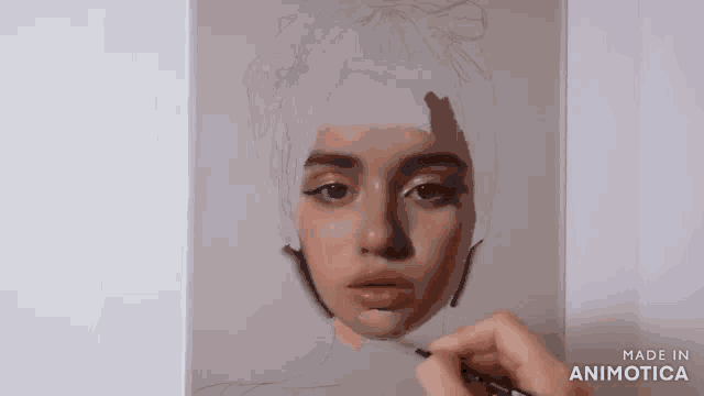 a person is painting a woman 's face with a brush on a canvas .