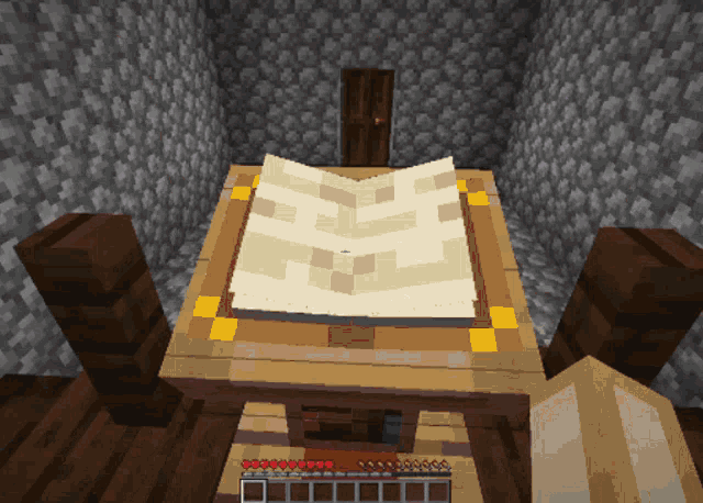 a minecraft screenshot of a table with a map on it
