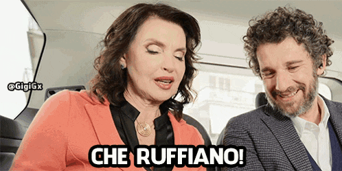 a man and a woman are sitting in a car and the woman is saying che ruffiano